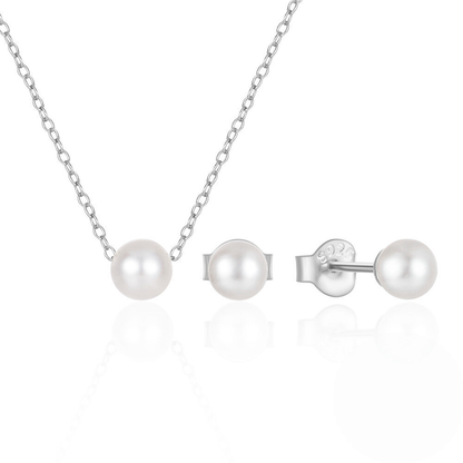 Pearl necklace and earrings set on a white background
