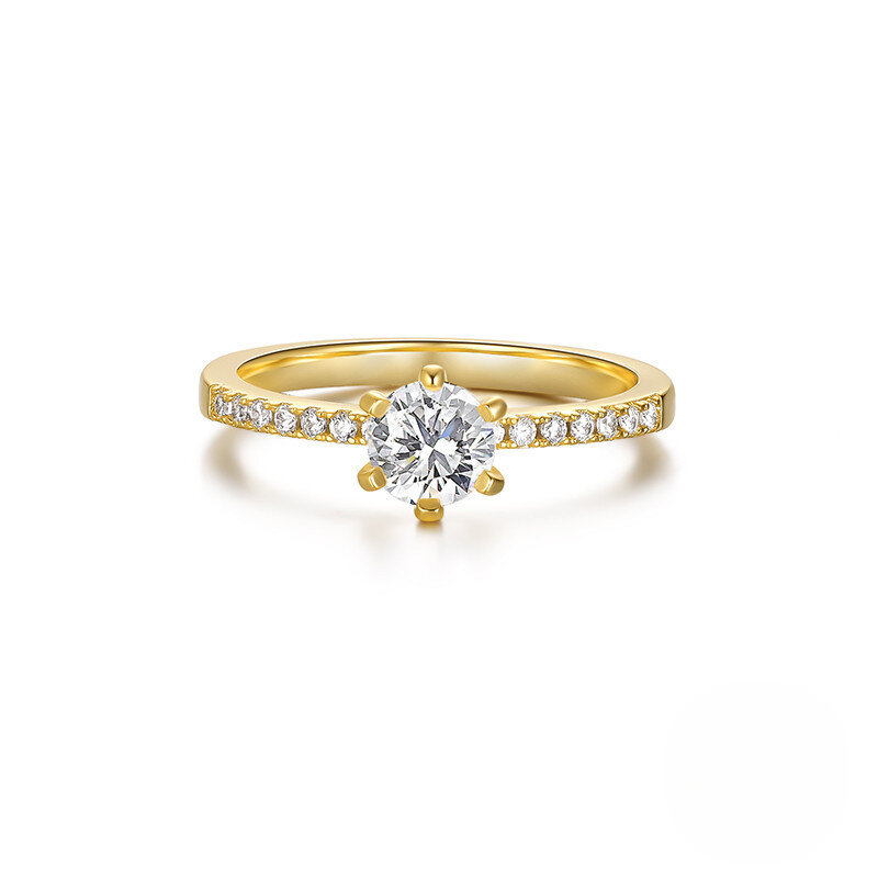 Gold ring with a diamond on a white background