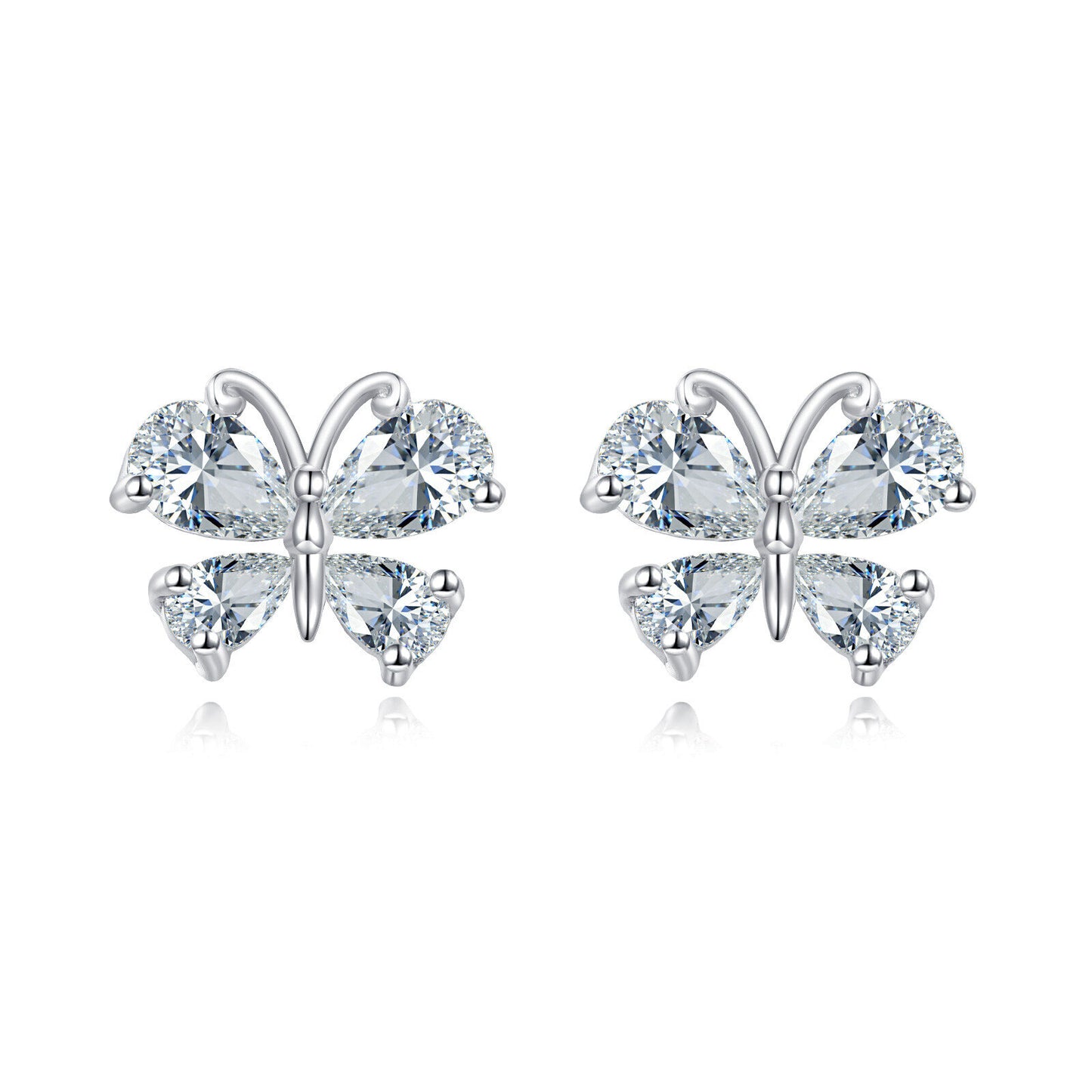 Butterfly-shaped earrings with clear gemstones on a white background