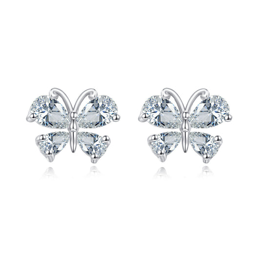 Butterfly-shaped earrings with clear gemstones on a white background