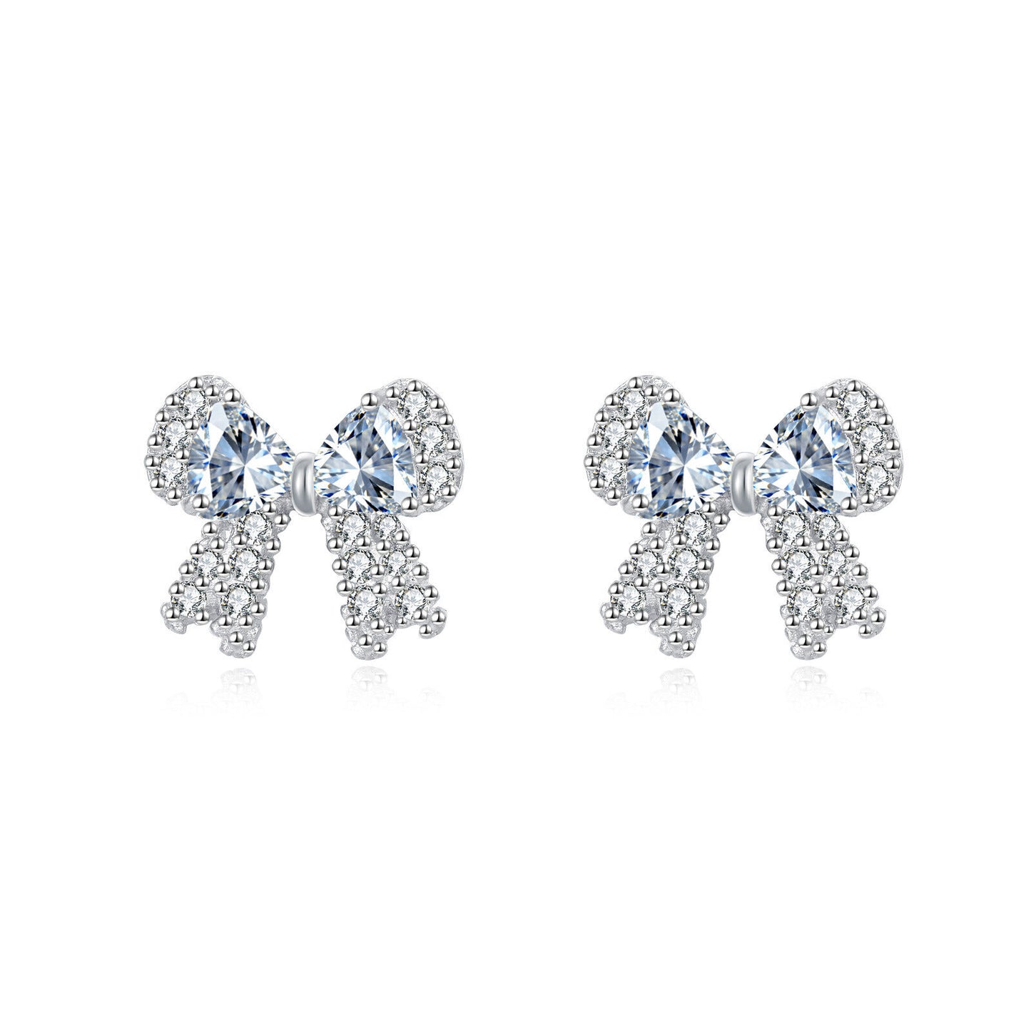 Bow-shaped earrings with clear gemstones on a white background