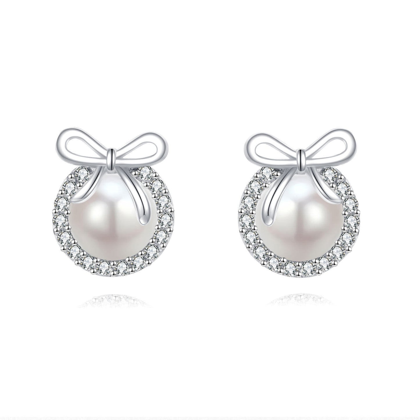 Pearl earrings with bow designs on a white background