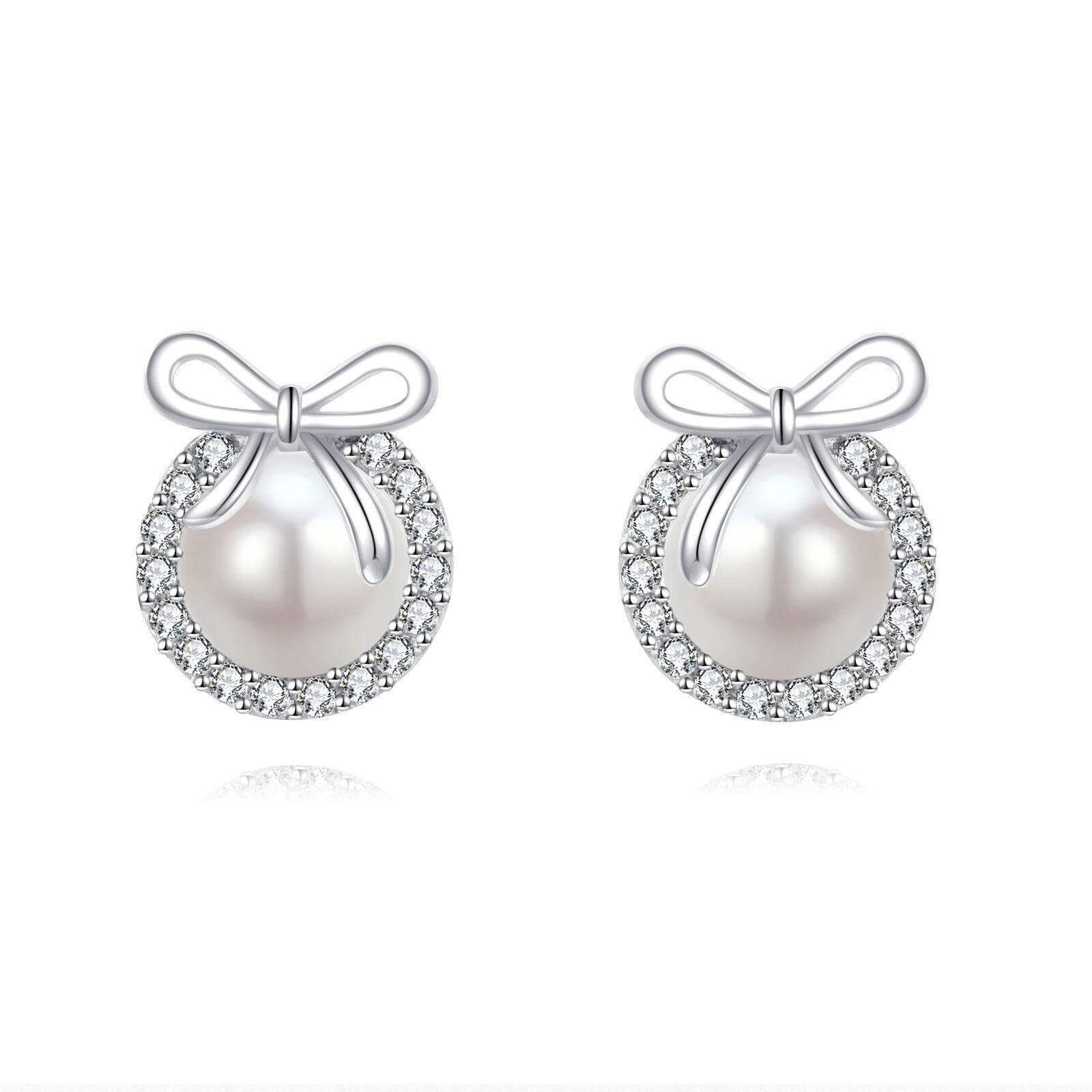Pearl earrings with bow designs on a white background